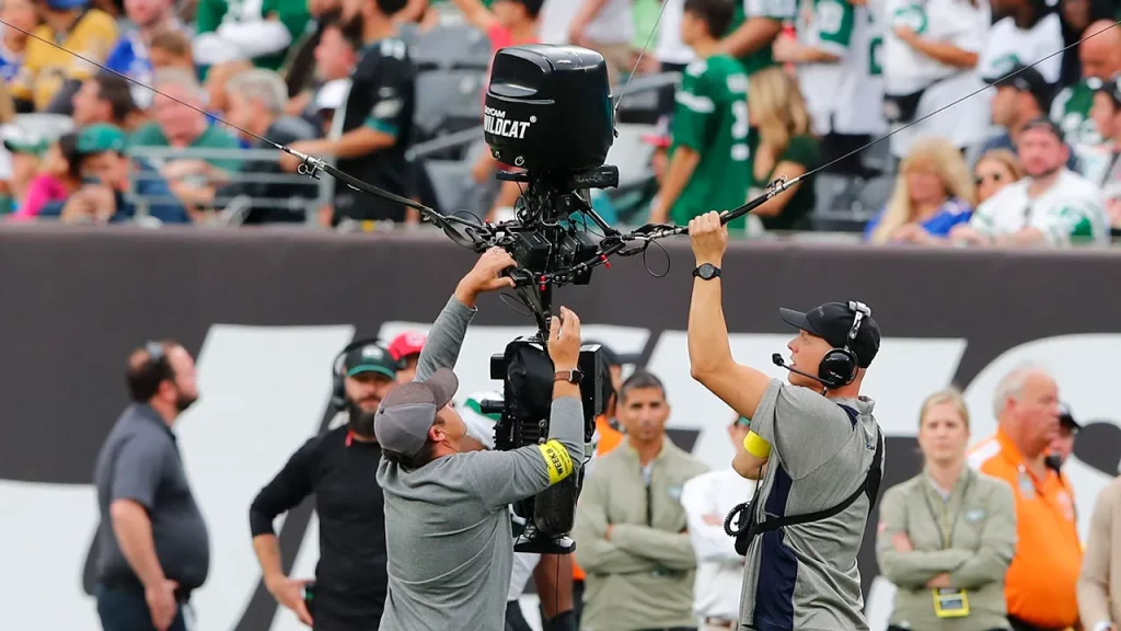Workers repair a remote camera during a delay during the second half of an NFL football game between the New York Jets and the Buffalo Bills, Sunday, Nov. 6, 2022, in East Rutherford, New Jersey.